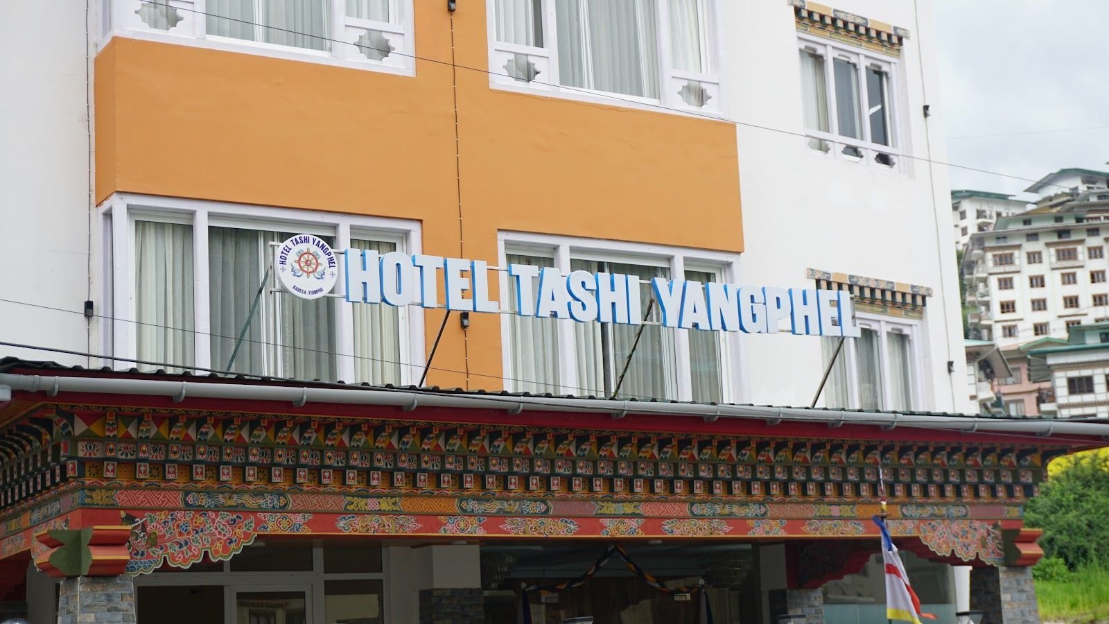 The hotel frontage with the Hotel Tashi Yangphel sign above the entrance
